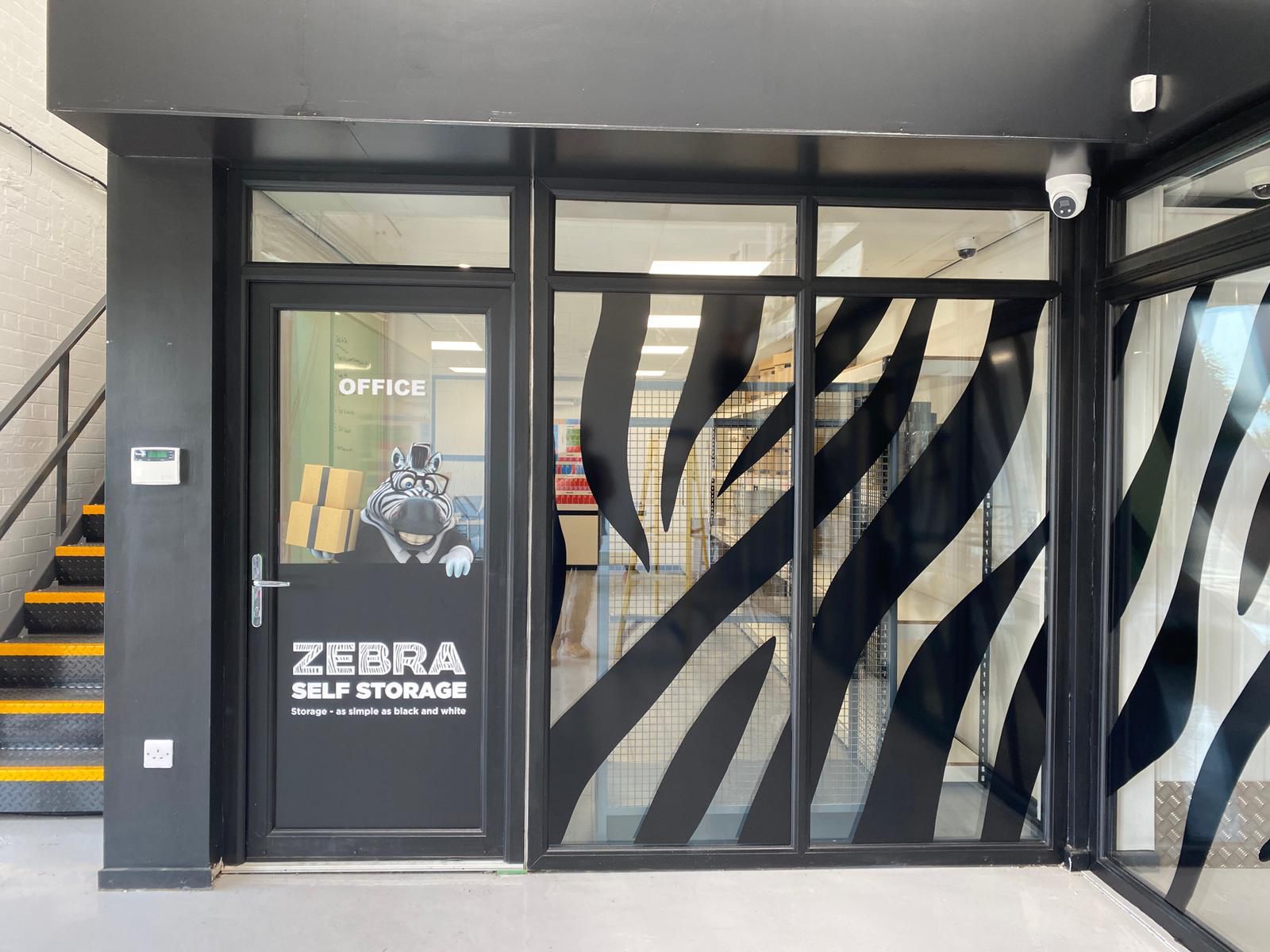 Entrance of Zebra Self Storage facility in Oldham with secure access and modern storage units